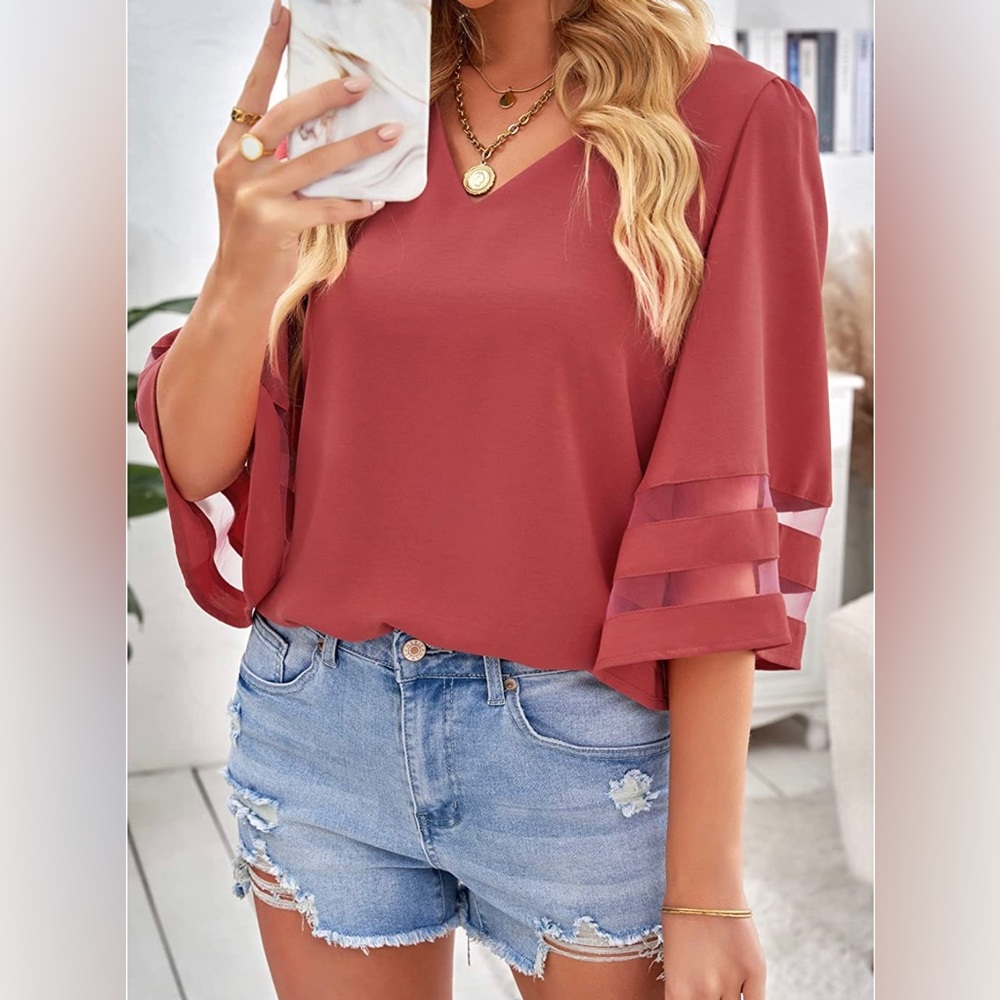 Gorgeous women’s blouse. Tea rose color, size medium. Never worn.